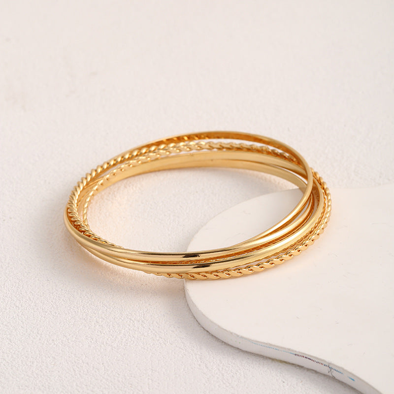 Women's bangle set with elaborate, braided and simple designs Symbol Fashion