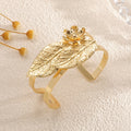 Ladies bangle with elaborate leaf design Symbol Fashion