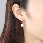Ladies earrings with elegant zirconia decorations and pearl pendants Symbol Fashion