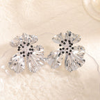 Women’s metal flower earrings with sparkling red accents Symbol Fashion