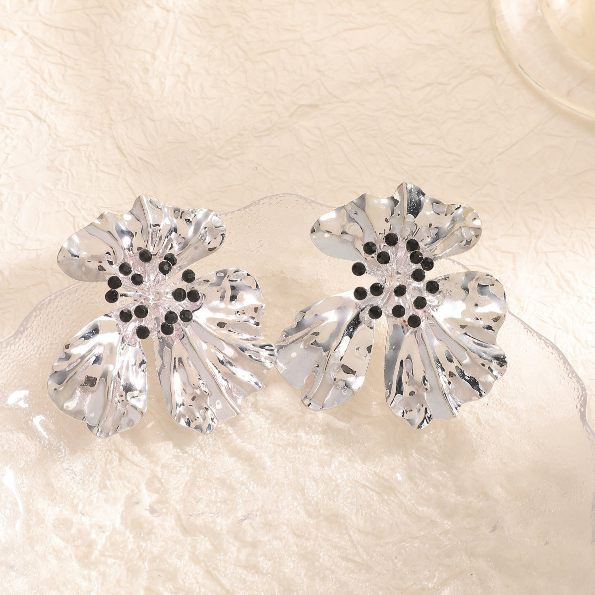 Women’s metal flower earrings with sparkling red accents Symbol Fashion