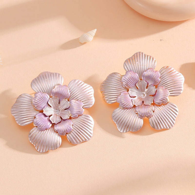 Ladies' flower earrings with intricate design and glossy accents Symbol Fashion