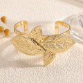 Ladies' bangle with artistic leaf design Symbol Fashion