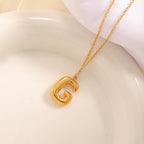 Women's necklace with curved letter pendant Symbol Fashion