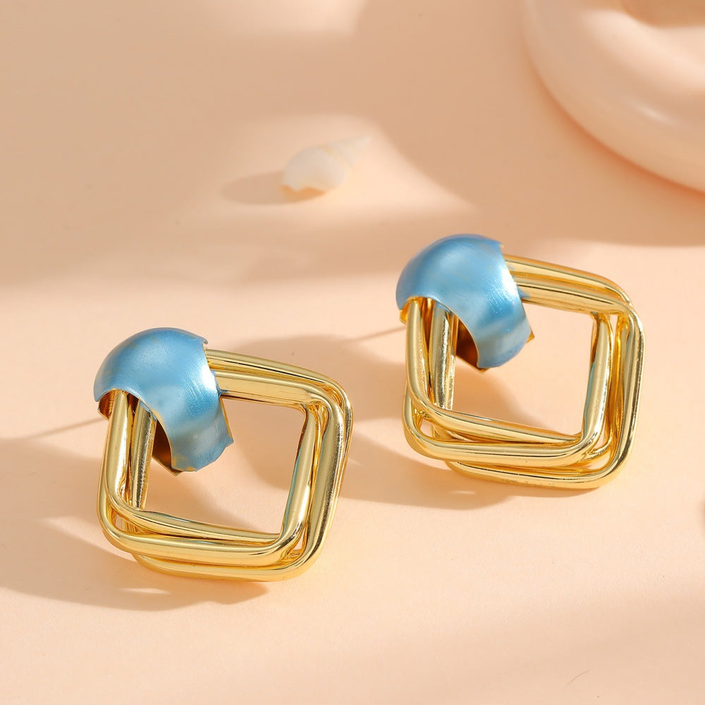 Women modern earrings with asymmetrical design Symbol Fashion
