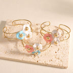 Women's bangle with elaborate floral design Symbol Fashion
