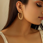 Ladies hoop earrings with intricate structures Symbol Fashion