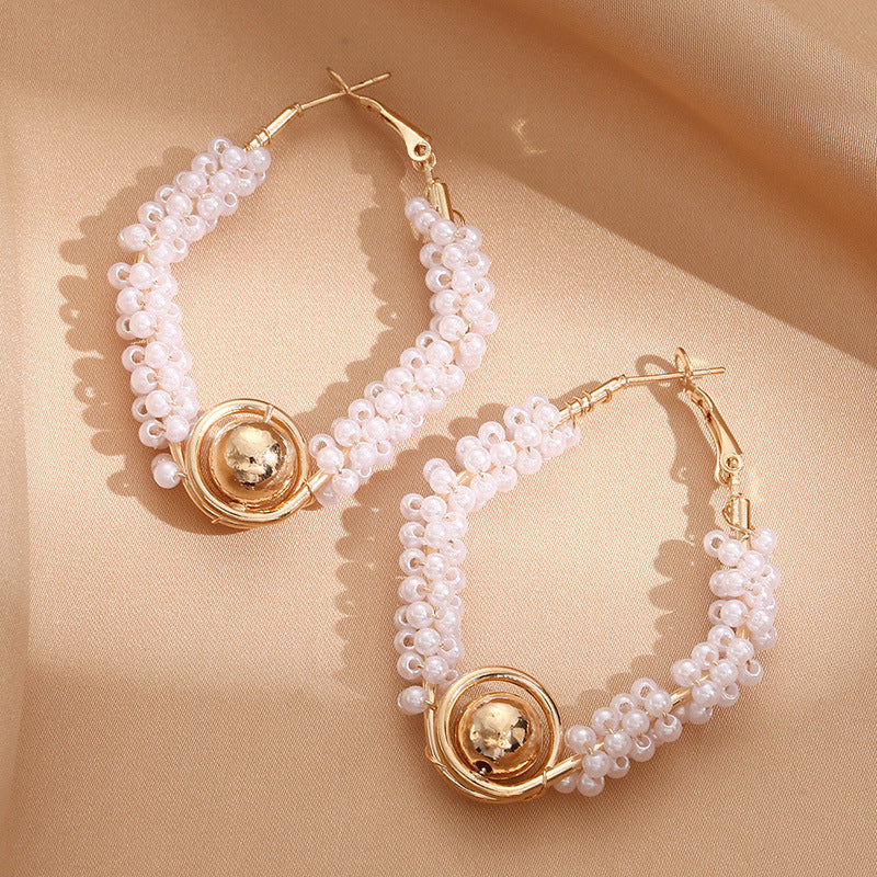 Women’s hoops with artistic pearl design Symbol Fashion