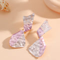 Ladies earrings in modern disc design Symbol Fashion