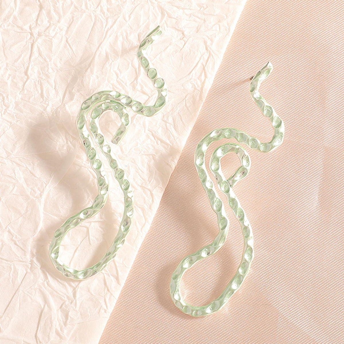 Ladies earrings in elegant wave pattern Symbol Fashion