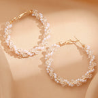 Ladies hoop earrings with luxurious pearl accents and elegant, twisted design Symbol Fashion