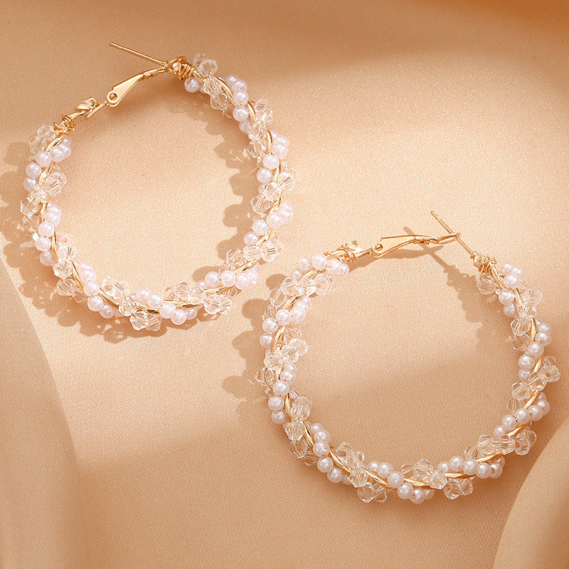 Ladies hoop earrings with luxurious pearl accents and elegant, twisted design Symbol Fashion