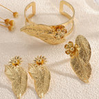 Ladies bangle with elaborate leaf design Symbol Fashion