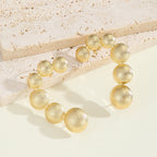 Women's bracelet with structured, golden beads Symbol Fashion