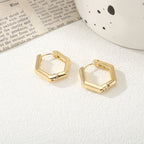 Women's hoop earrings with modern, textured design Symbol Fashion