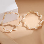 Ladies hoop earrings with luxurious pearl accents and elegant, twisted design Symbol Fashion