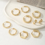 Women's hoop earrings with modern, textured design Symbol Fashion