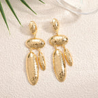 Women Hanging Earrings with artistic, three-dimensional design Symbol Fashion