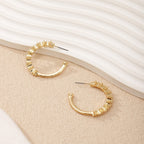 Ladies hoop earrings with intricate structures Symbol Fashion
