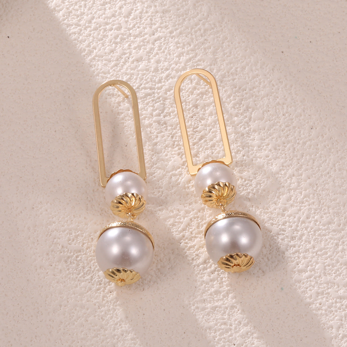 Ladies earrings with elegant pearl design Symbol Fashion
