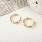 Women's hoop earrings with modern, textured design Symbol Fashion