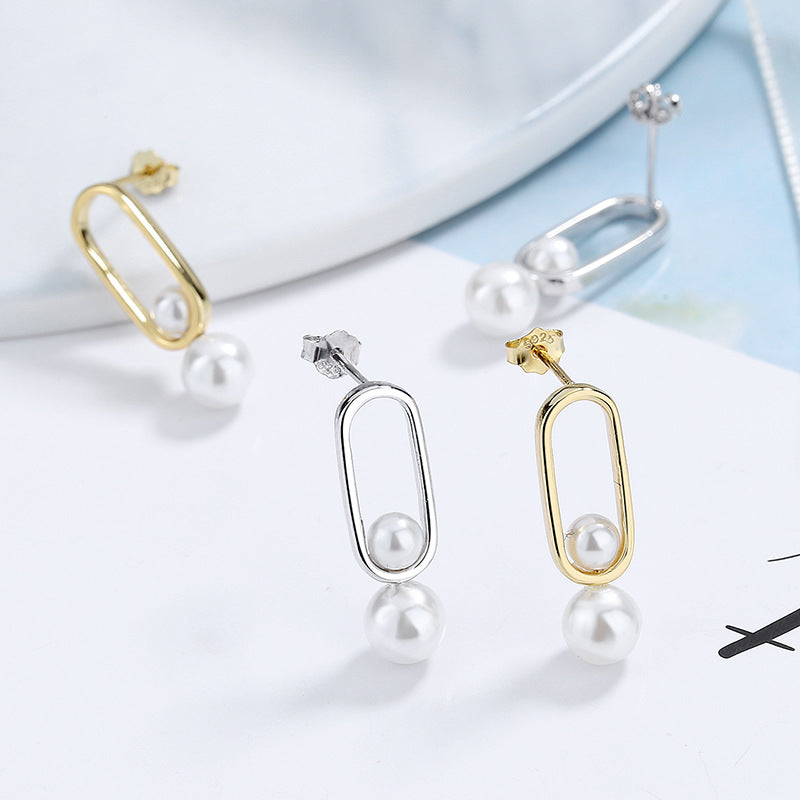 Women's stud earrings with modern oval design and elegant pearls Symbol Fashion