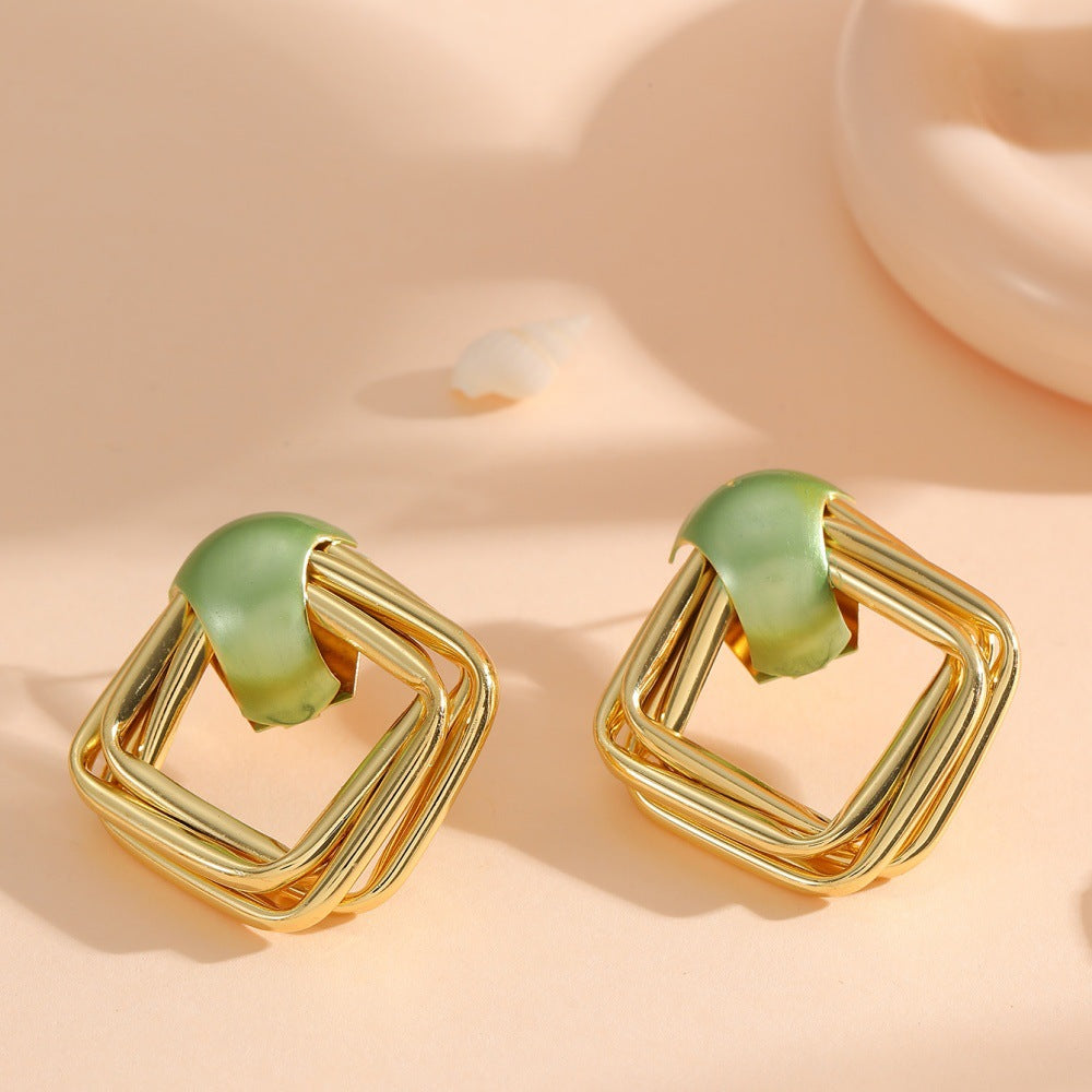 Women modern earrings with asymmetrical design Symbol Fashion