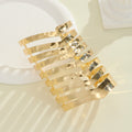 Women's hair accessories with shiny, curved elements Symbol Fashion