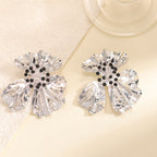 Women’s metal flower earrings with sparkling red accents Symbol Fashion