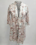 Women’s beach dress with high collar and romantic floral pattern